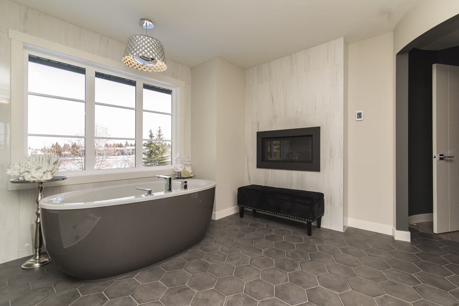 Bathroom featuring a mix of matte and glossy tile finishes 