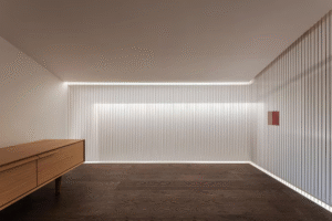 Minimalist room with cove lighting