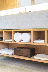 Bathroom interior highlighting efficient storage and sleek vanity